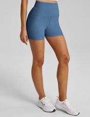 blue high-waisted biker shorts with a 3" inseam.