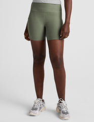 green high-waisted 5" inseam biker shorts  with pockets.
