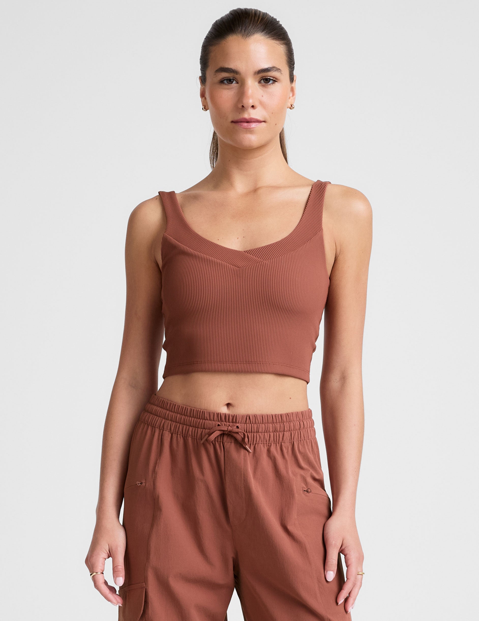 red ribbed cropped tank top with a soft front and back v neckline.