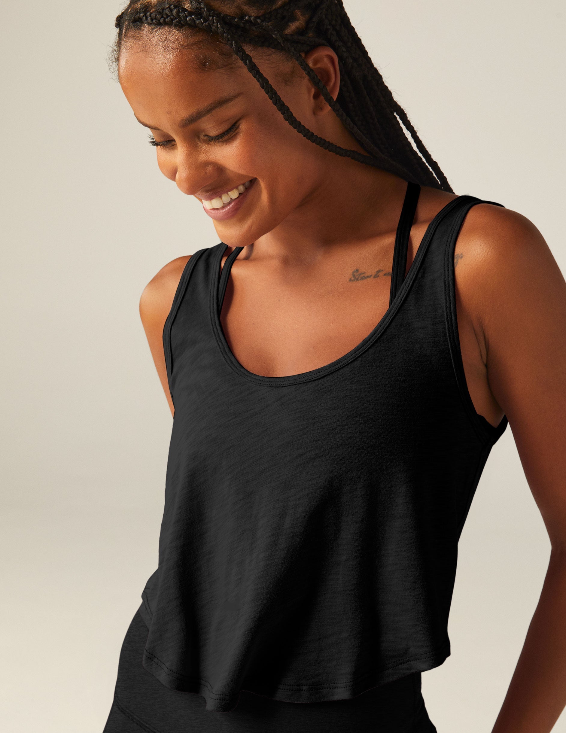 black scoop neck cropped tank top.