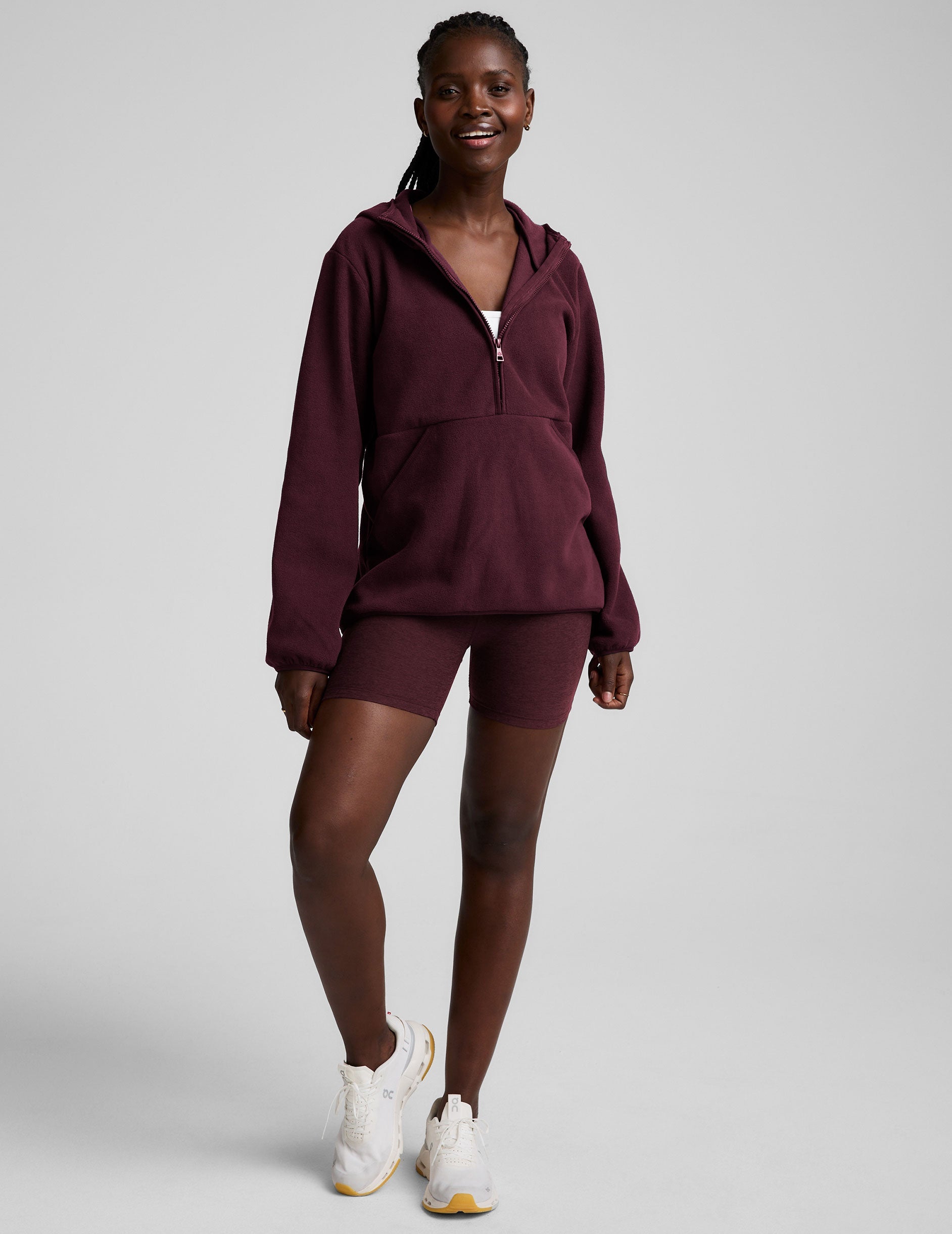 red fleece quarter zip jacket with a kangaroo pocket.
