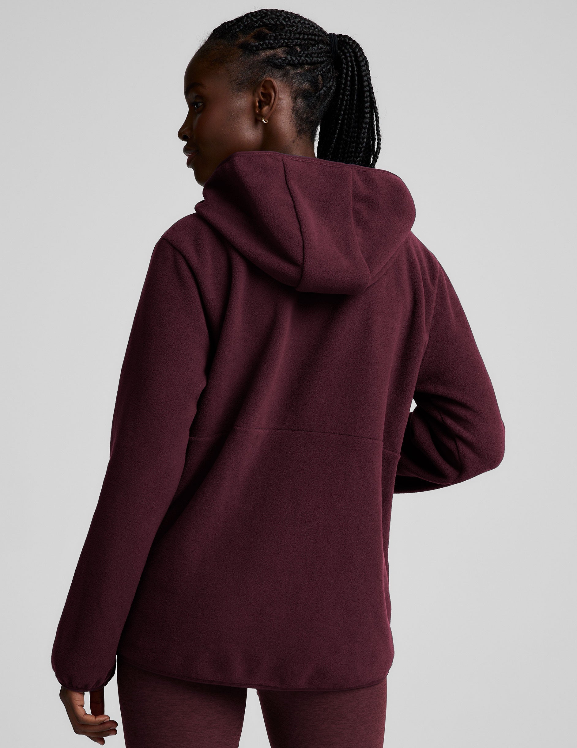 red fleece quarter zip jacket with a kangaroo pocket.
