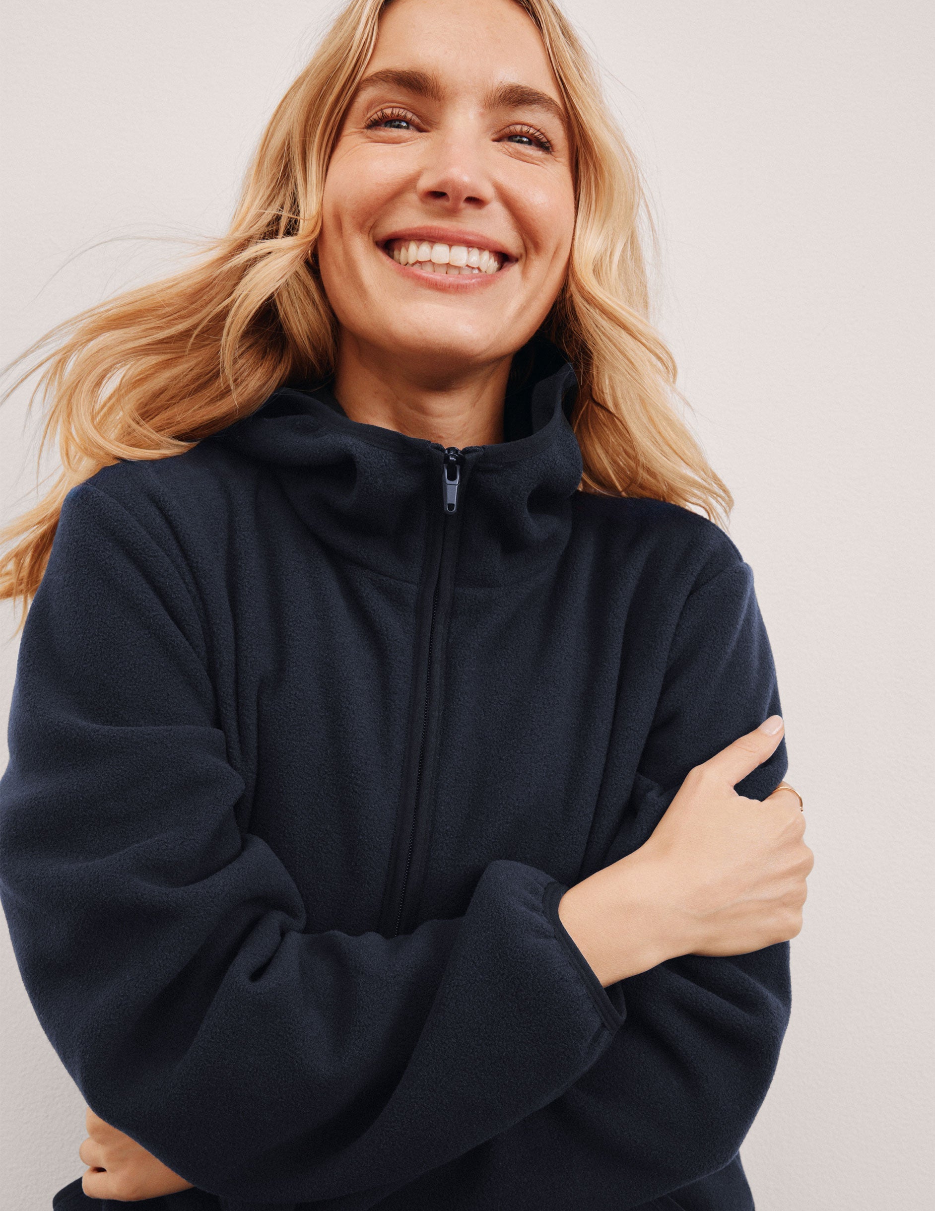 blue fleece quarter zip jacket with a kangaroo pocket.
