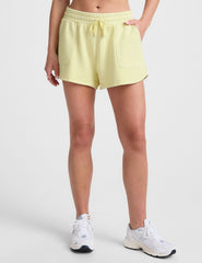 yellow terry shorts with pockets and a drawcord at waist.