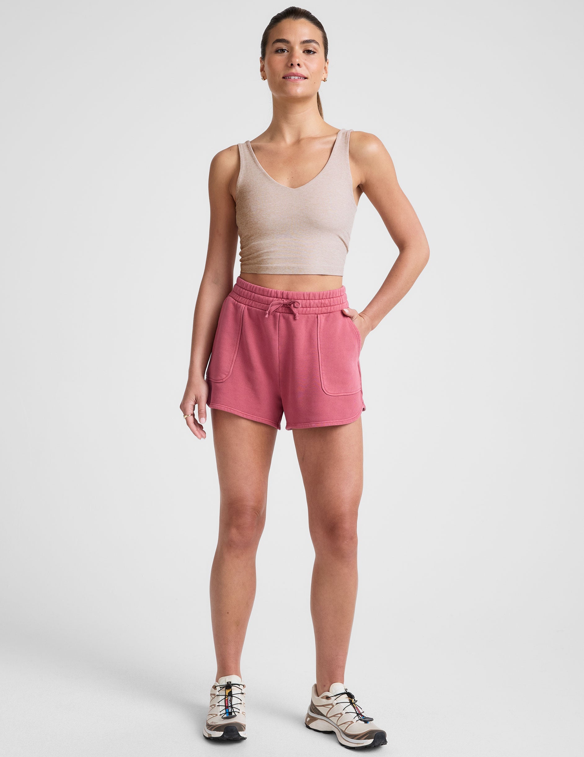 red terry shorts with pockets and a drawcord at waistband.