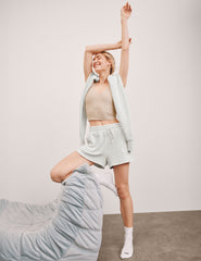 white relaxed fit terry shorts with patch pockets.