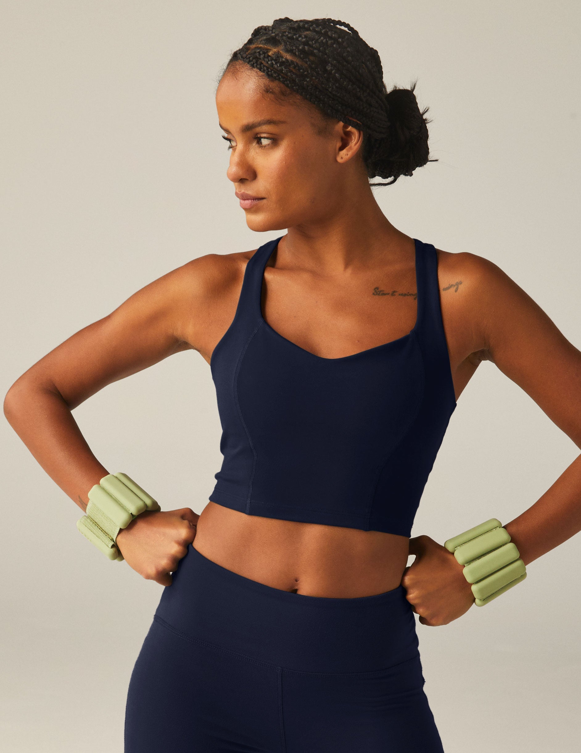navy blue racerback cropped tank top with a built-in bra and princess seams.