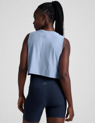 blue relaxed fit cropped tank top with a crew neckline.