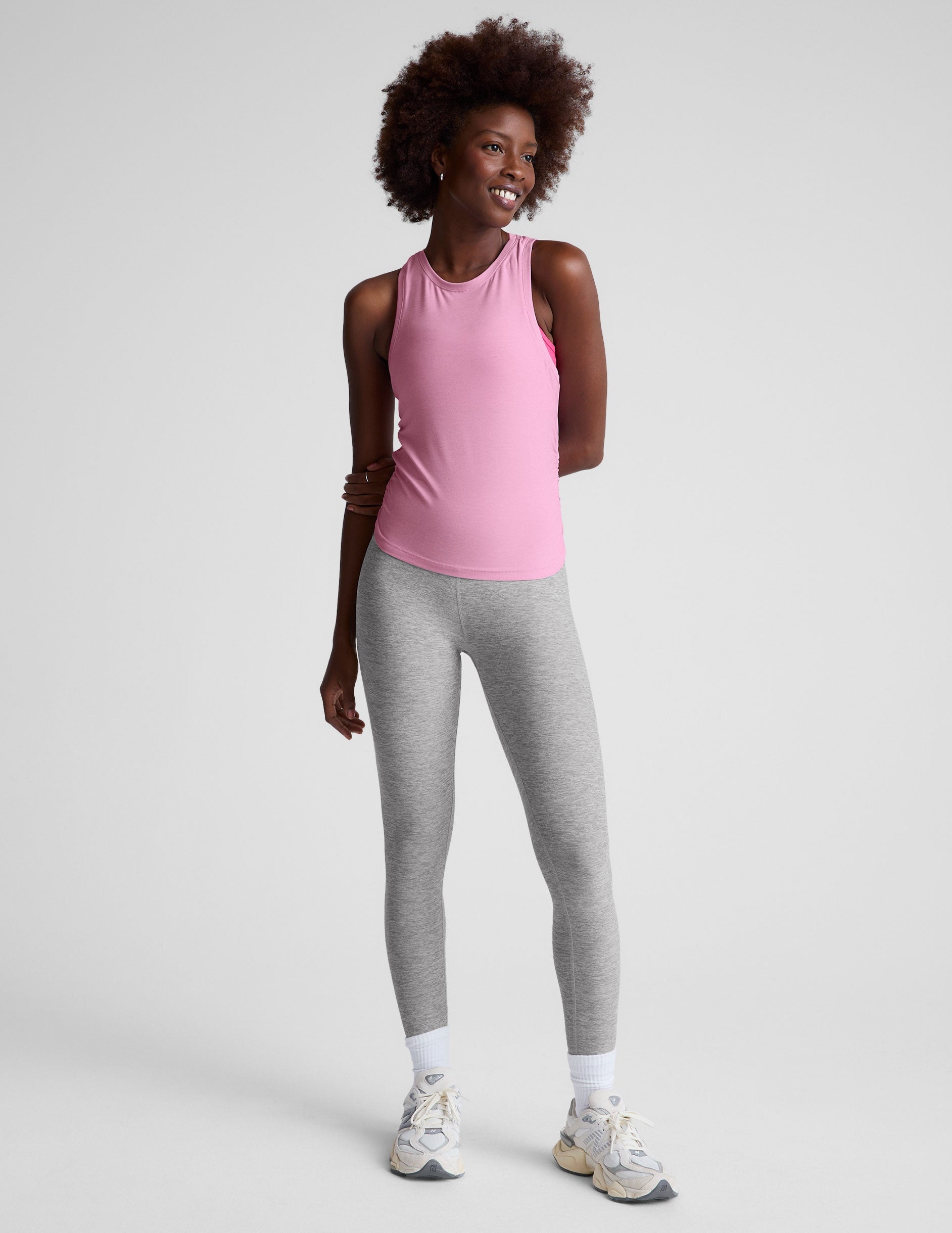 pink scoop neck tank top with shirred detailing on the sides.