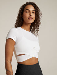 white short sleeve top with criss cross detail at front