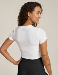white short sleeve top with criss cross detail at front