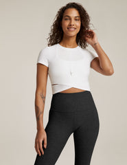 white short sleeve top with criss cross detail at front