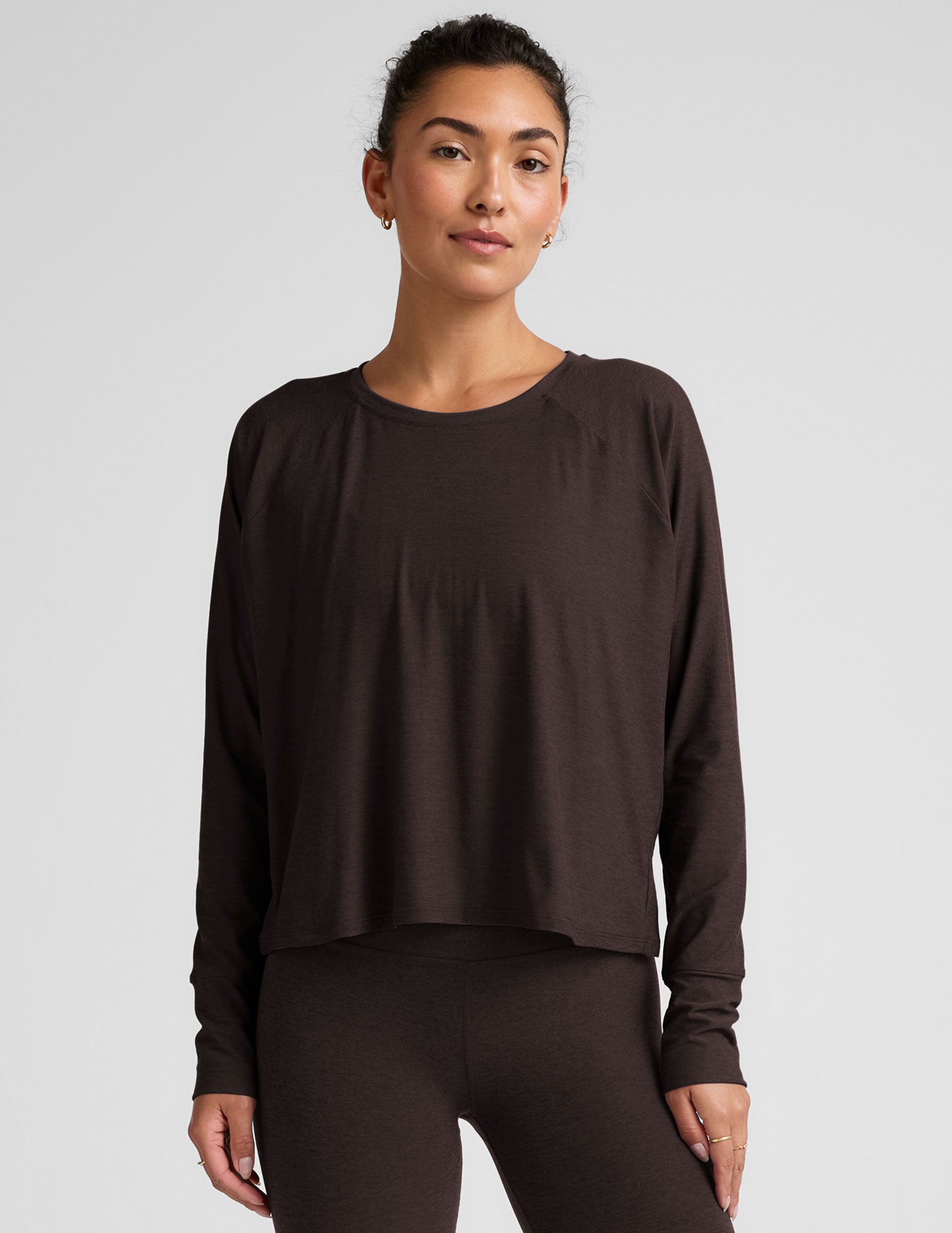 brown long sleeve crew neck top.