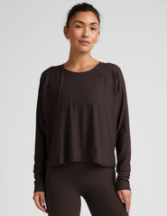 brown long sleeve crew neck top.