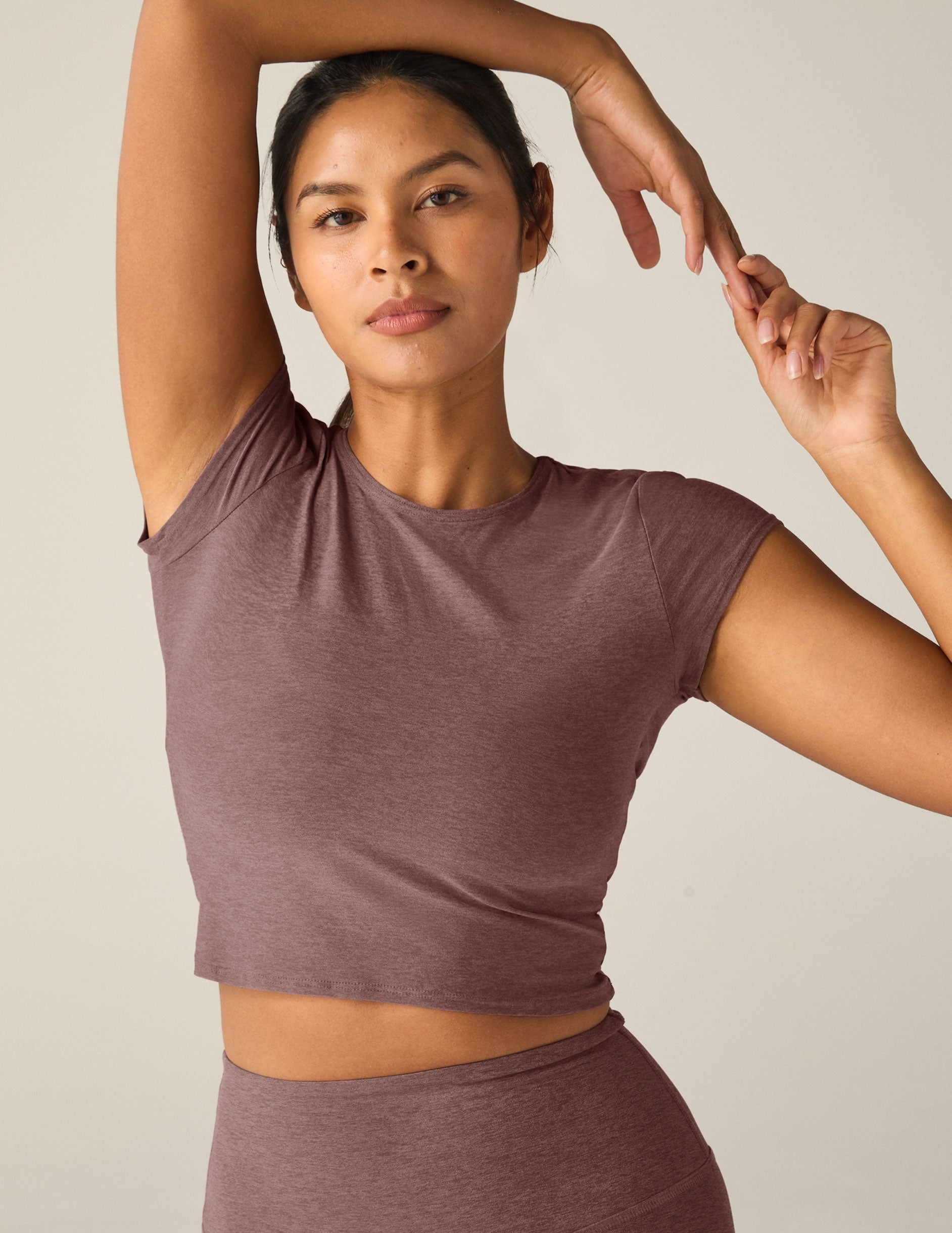 red short sleeve cropped t-shirt with a cutout detail on back.