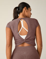 red short sleeve cropped t-shirt with a cutout detail on back.