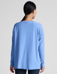 blue long sleeve maternity top with a crew neckline.