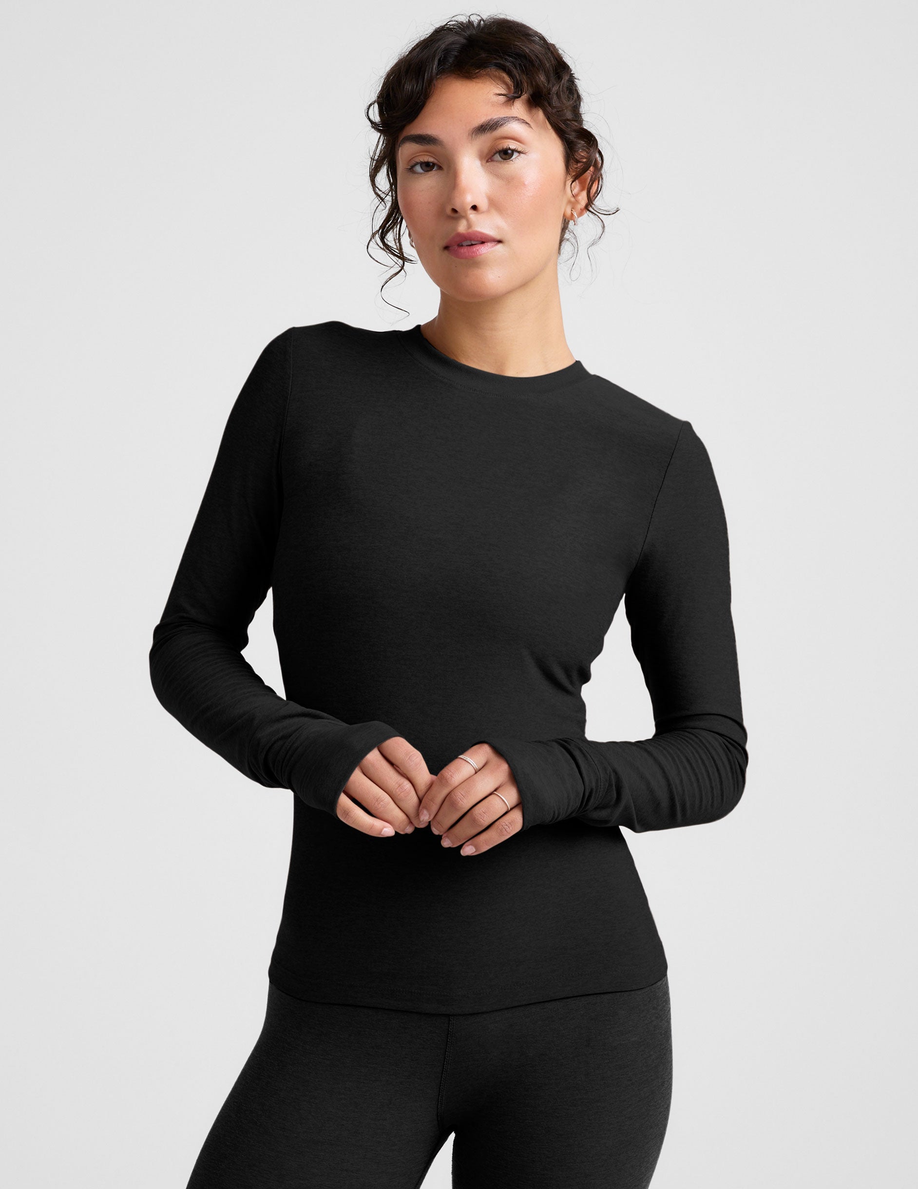 black crew neck long sleeve with thumb holes.