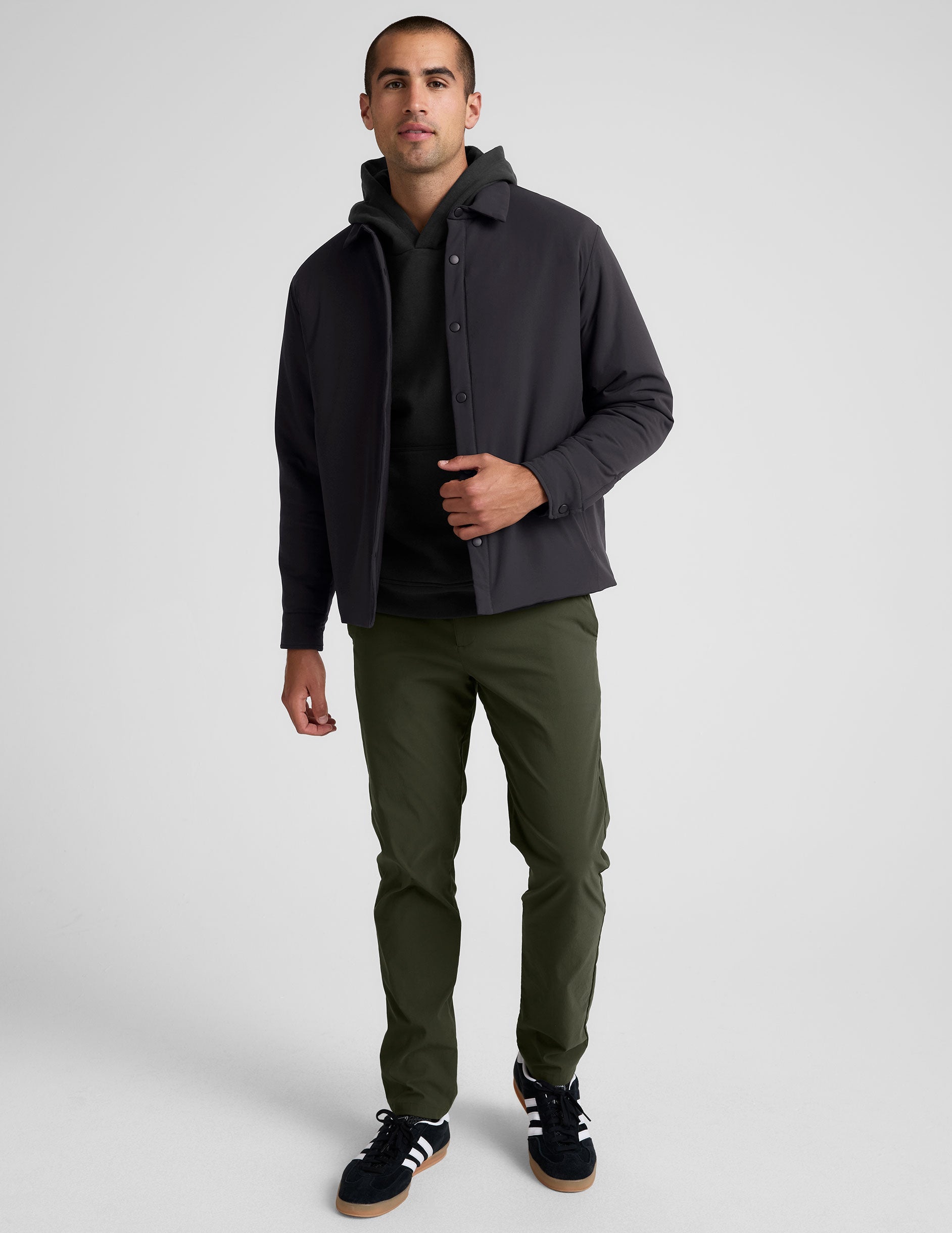 black men's button up insulated jacket with a shirt collar and side seam invisible zipper pockets.