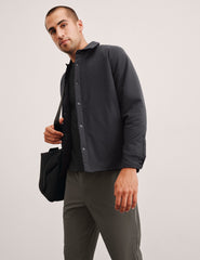 black men's button up insulated jacket with a shirt collar and side seam invisible zipper pockets.
