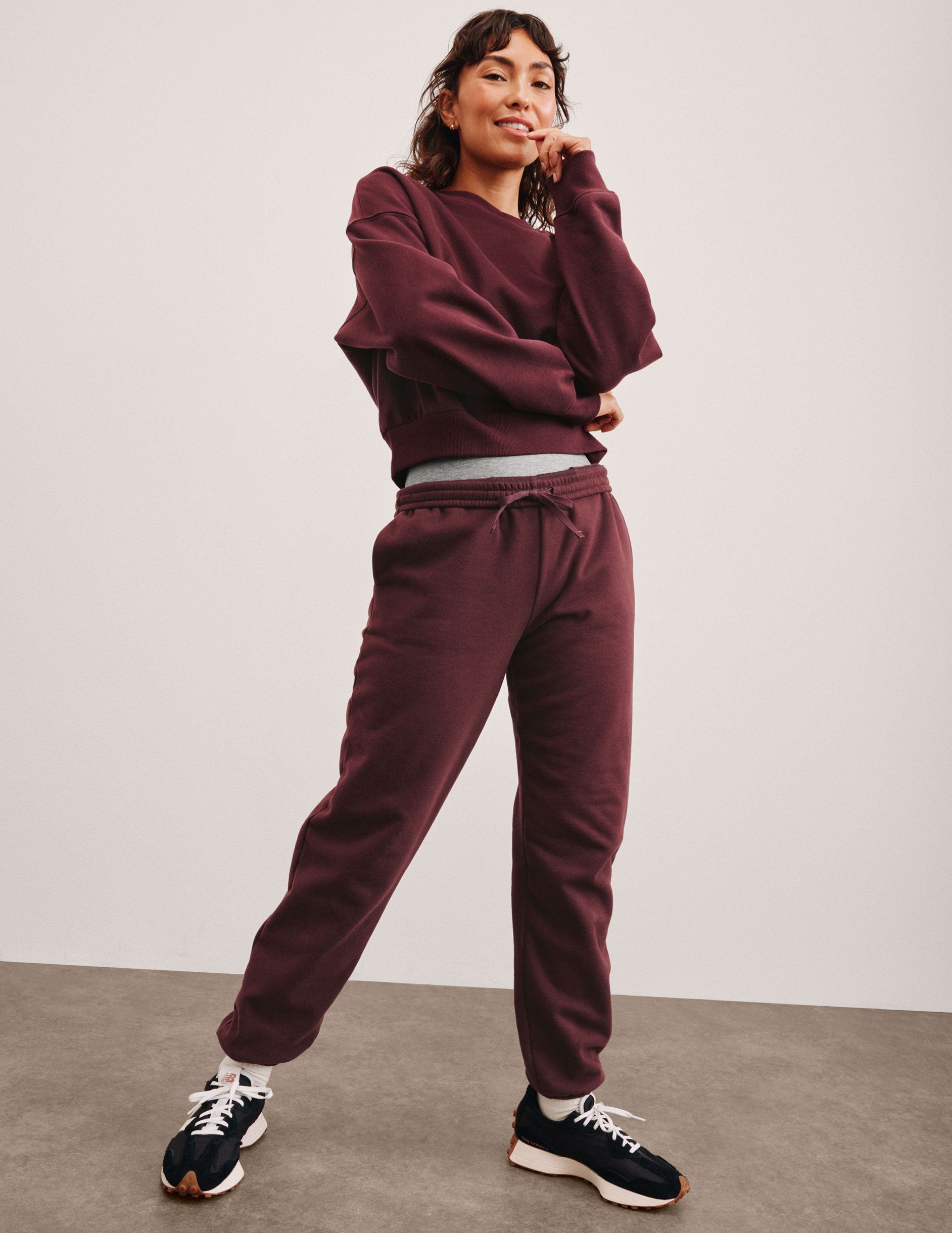 red sweatpants with pockets and a drawstring at waistband.