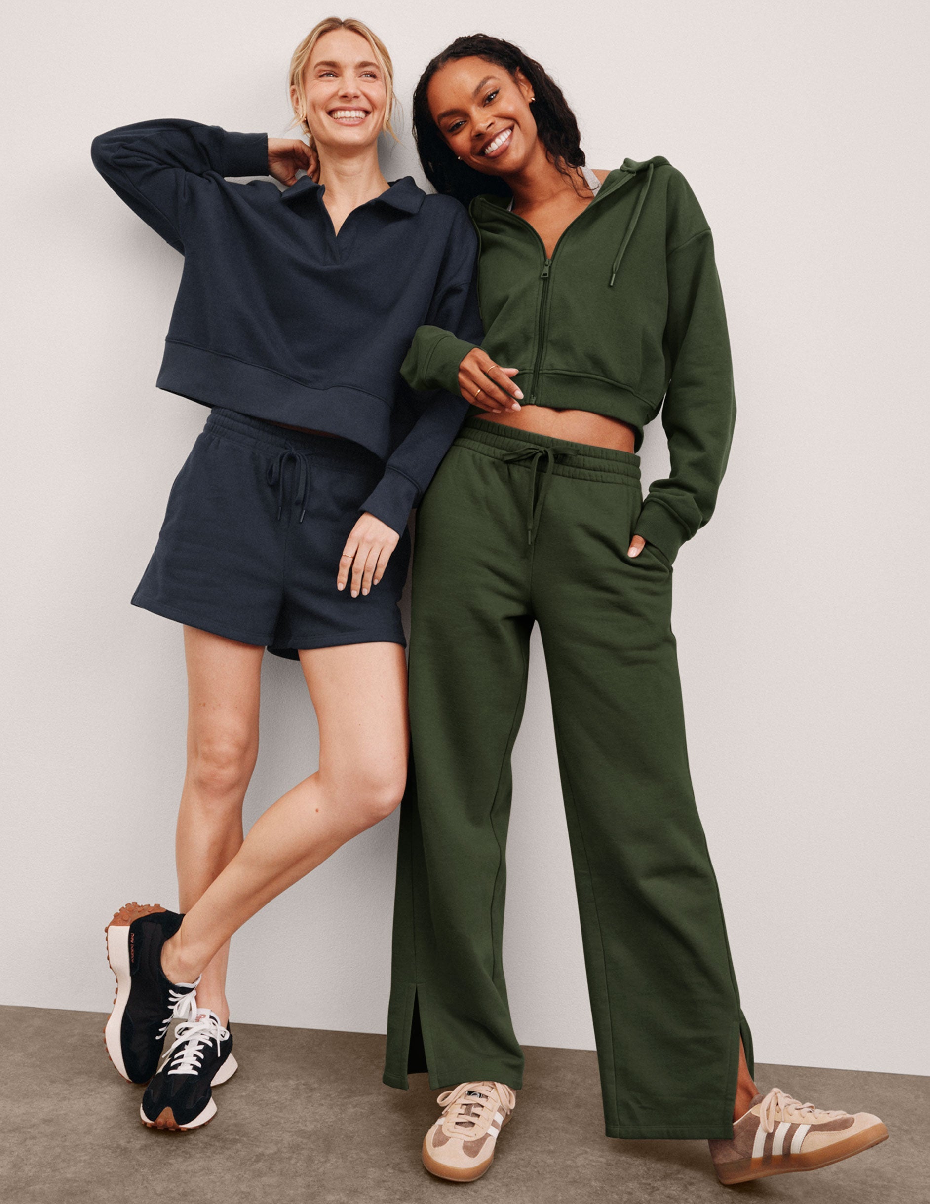 green mid-rise wide leg sweatpants with side slits and a drawcord at waistband.