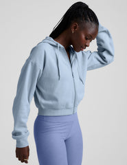 blue fleece zip-up jacket with a drawstring hood.