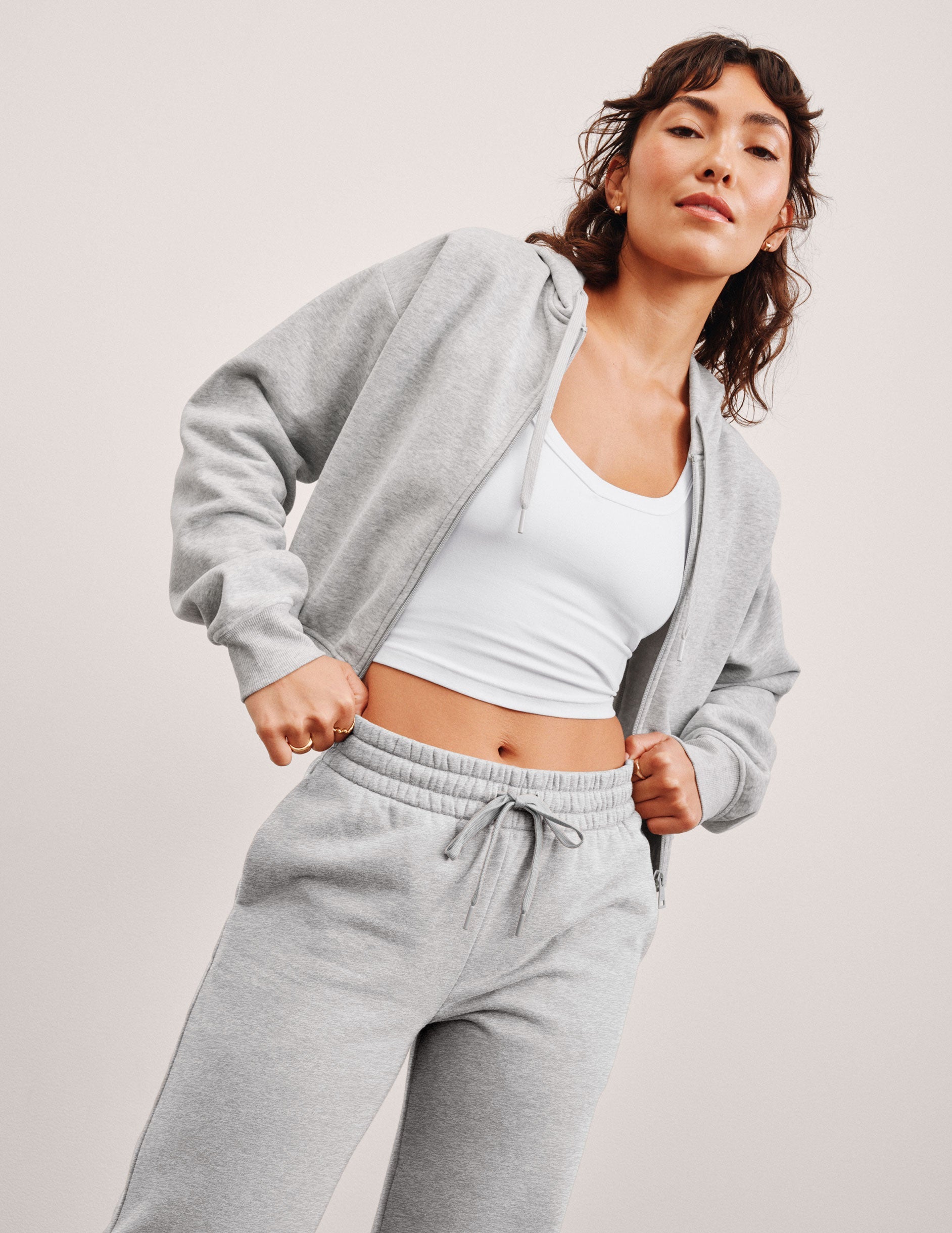 gray fleece zip-up jacket with a drawstring hood.