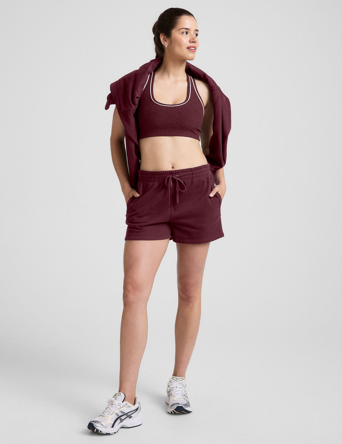 red mid rise sweat shorts with a 3.5" inseam and pockets. 