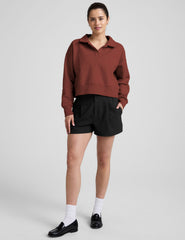 brown v-neck collared sweater.