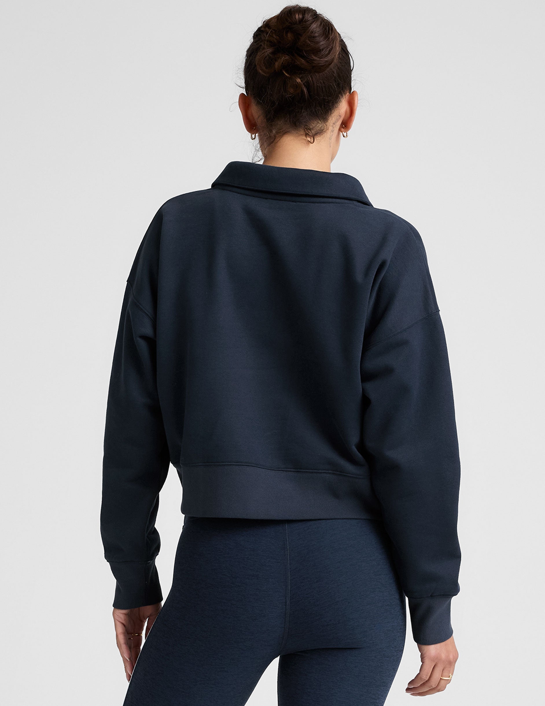 blue cropped long sleeve pullover with a v-neck collared neckline.
