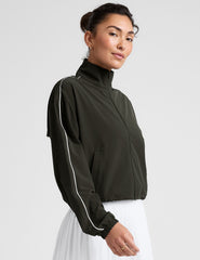 green zip-up jacket with white piping and pockets.