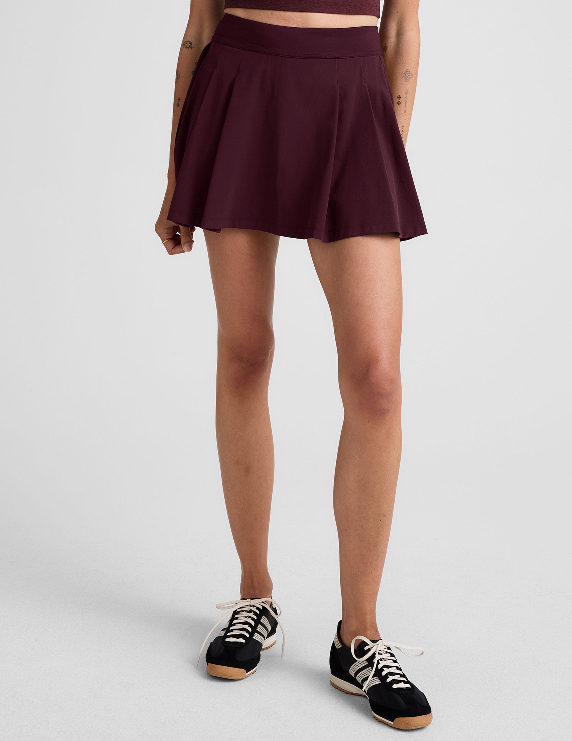 red mini skirt with built-in shorts with pockets.