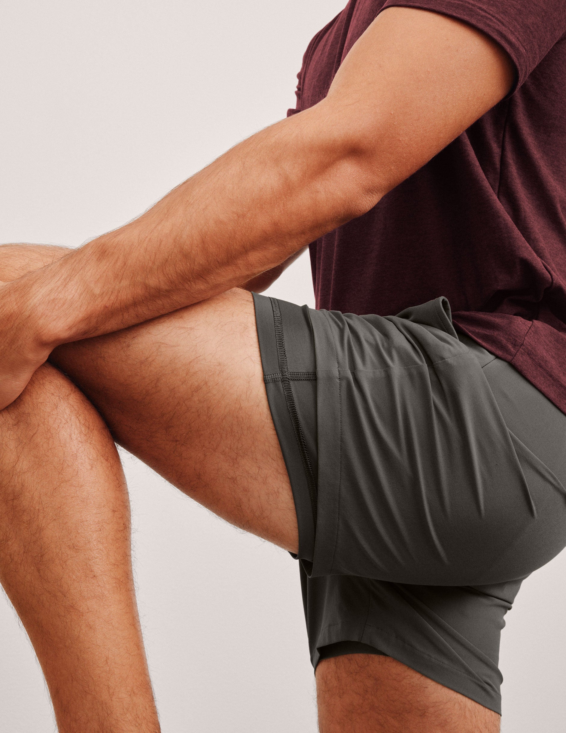 grey men's 5" shorts on a plain background. 
