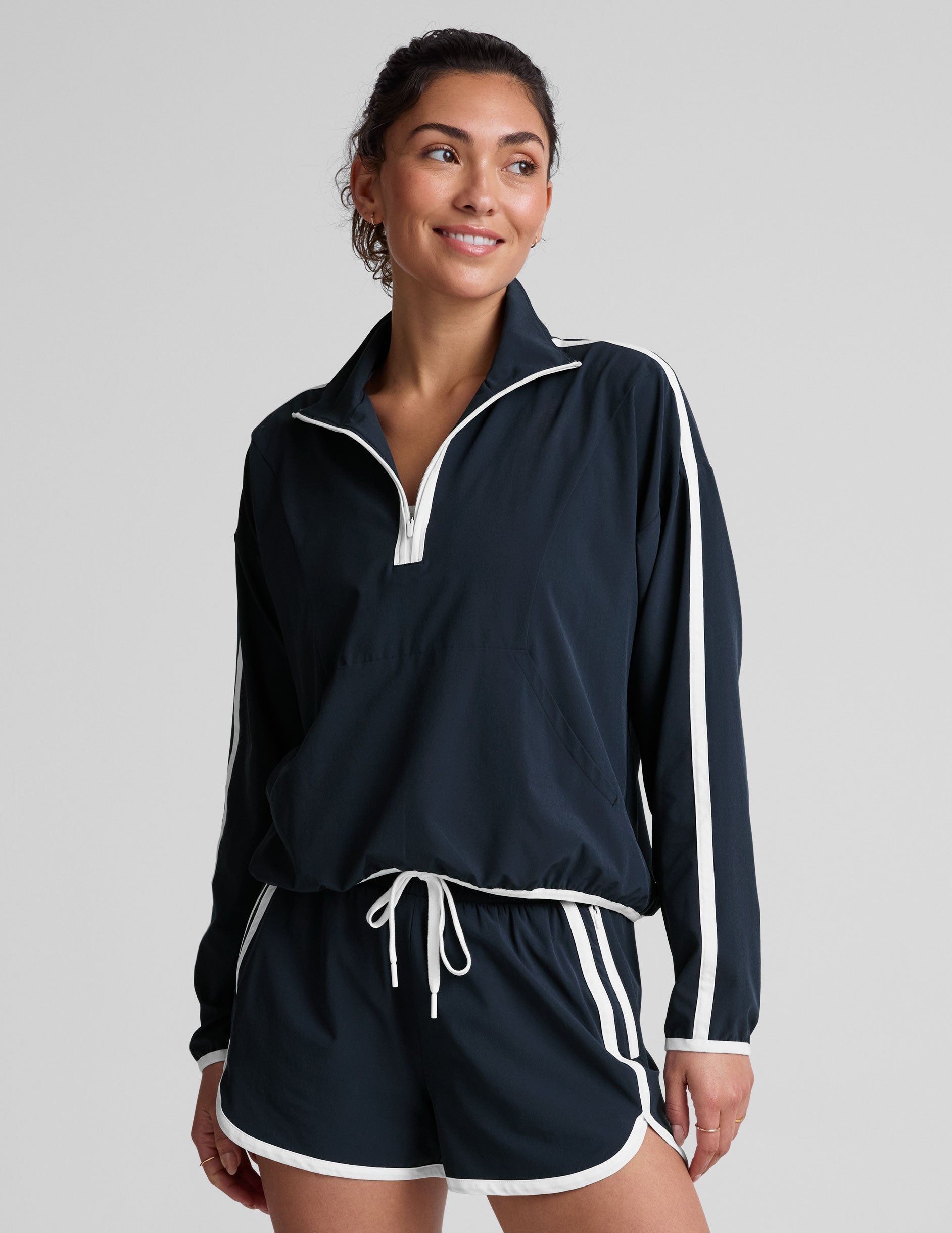 blue pullover with a half zip front​ and front kangaroo pocket​.