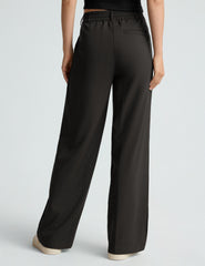black mid rise jetstretch woven pants with cargo style pockets.