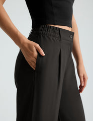 black mid rise jetstretch woven pants with cargo style pockets.