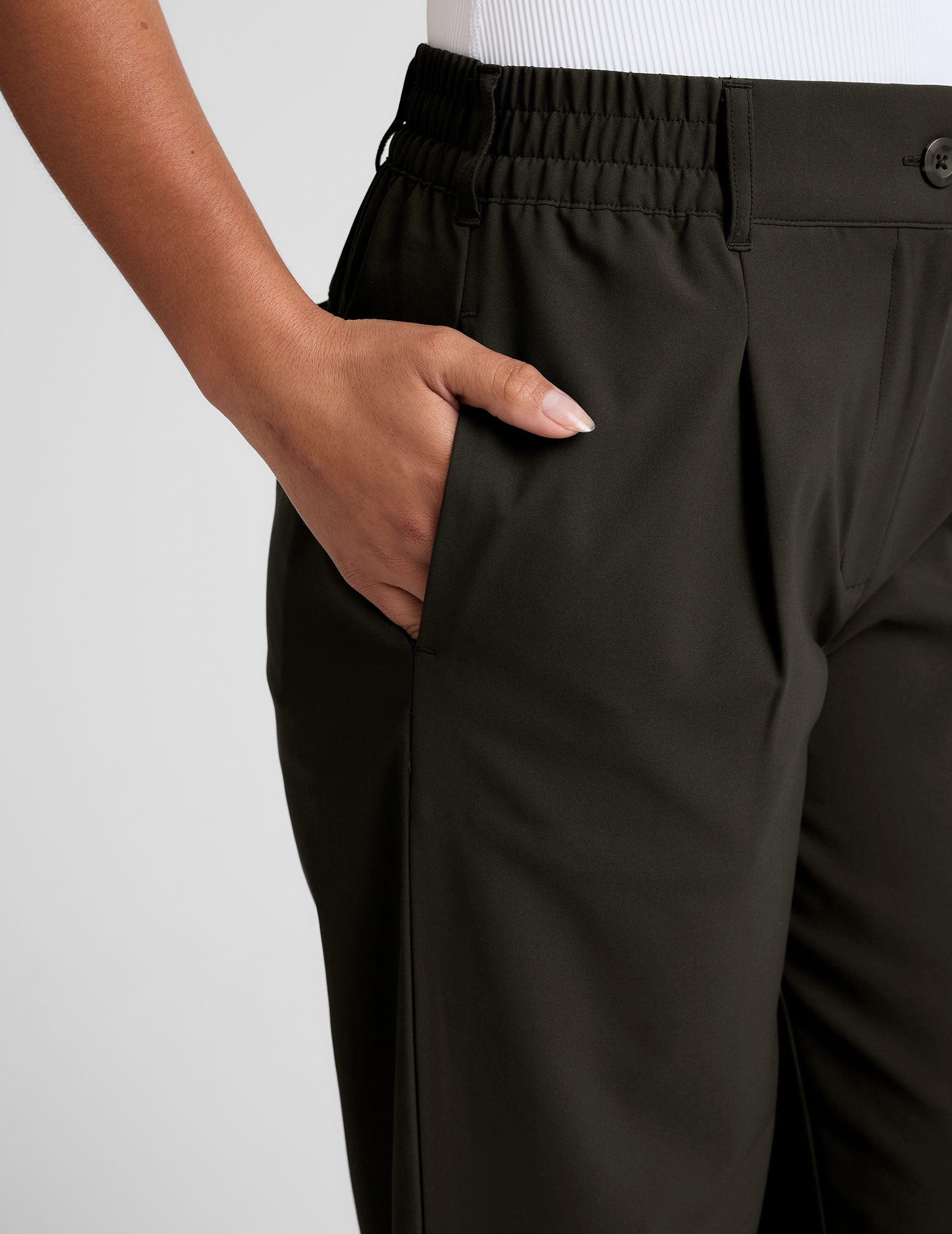 green trouser pants with pockets.