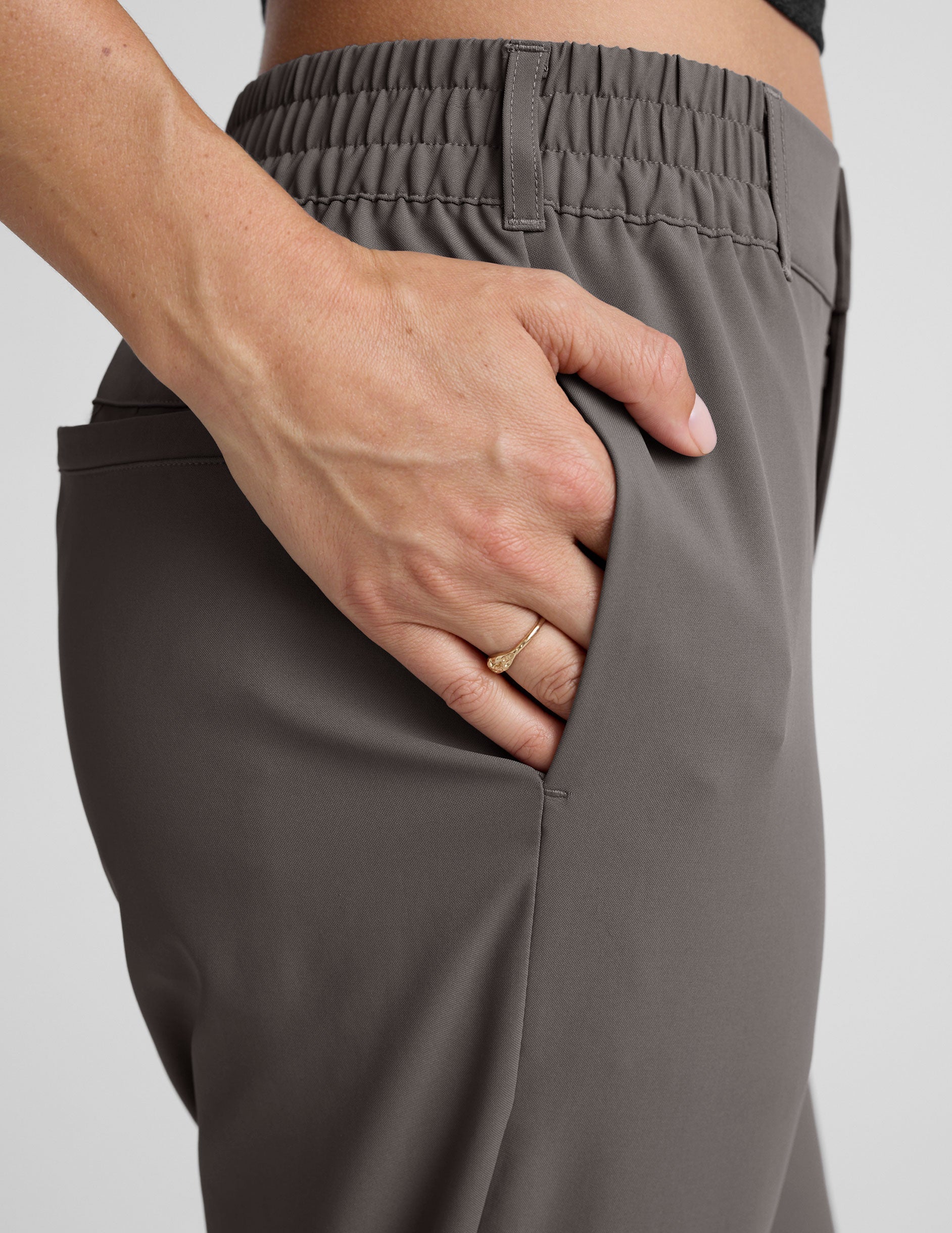 gray trouser style pant with a tapered ankle and pockets.