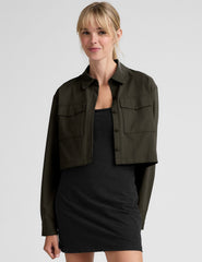 green cropped jacket with front chest cargo pockets and a collar at neckline.