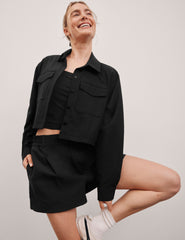 black 4" inseam shorts with an elastic waistband with belt loops​ and side seam pockets. 