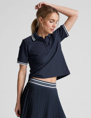 white fitted polo style short sleeve t-shirt with a stripe rib collar and cuff, front placket with buttons, and side slits. 
