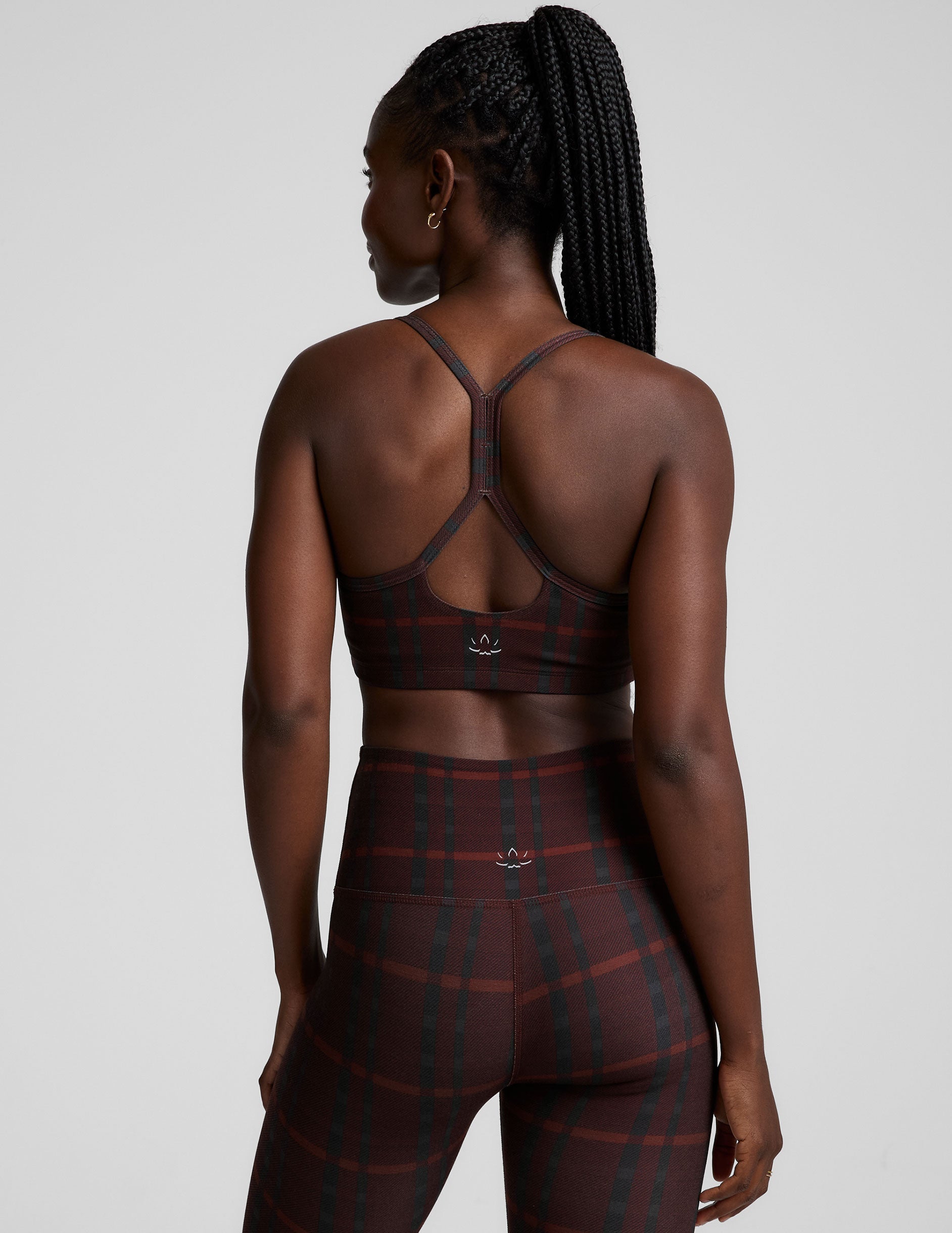 red racerback style bra with a plaid print and thin straps.