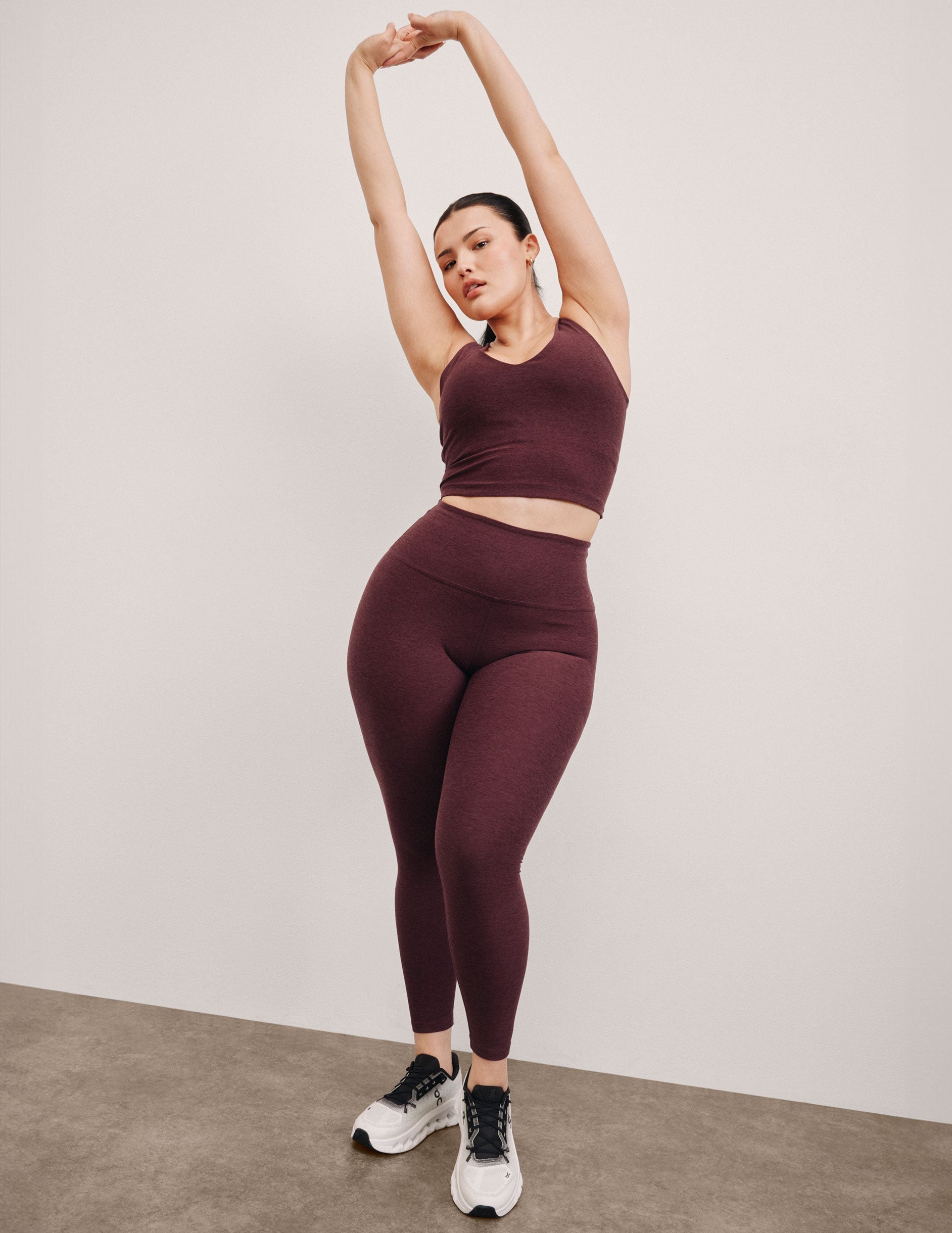red high-waisted midi length leggings.