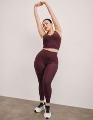 red high-waisted midi length leggings.