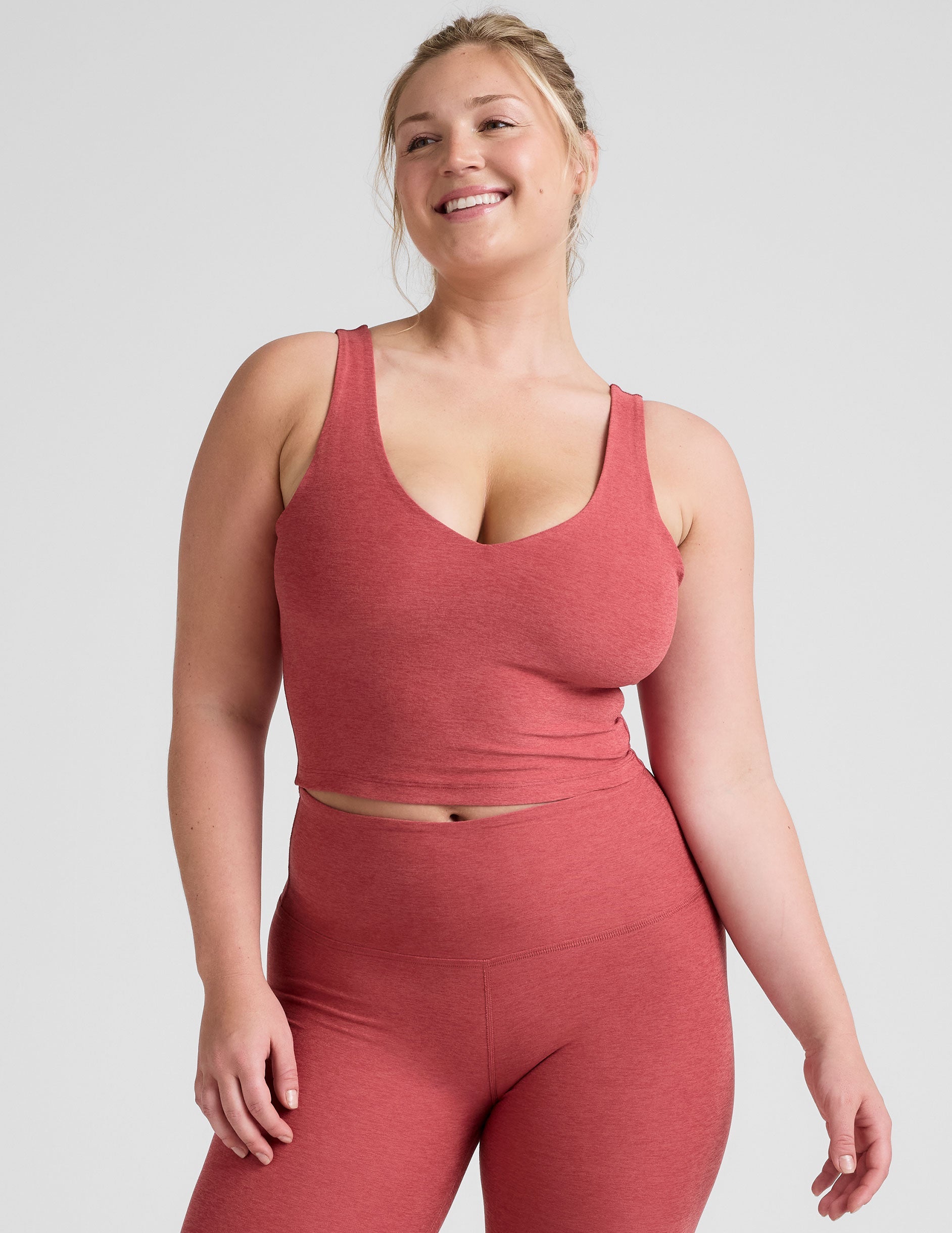 red cropped tank top with a front and back v neckline.