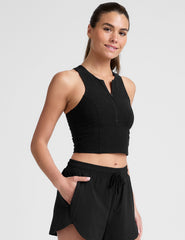 black cropped tank with a high neck with center front zipper.