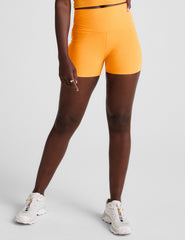 orange high-waisted 3" inseam biker shorts. 