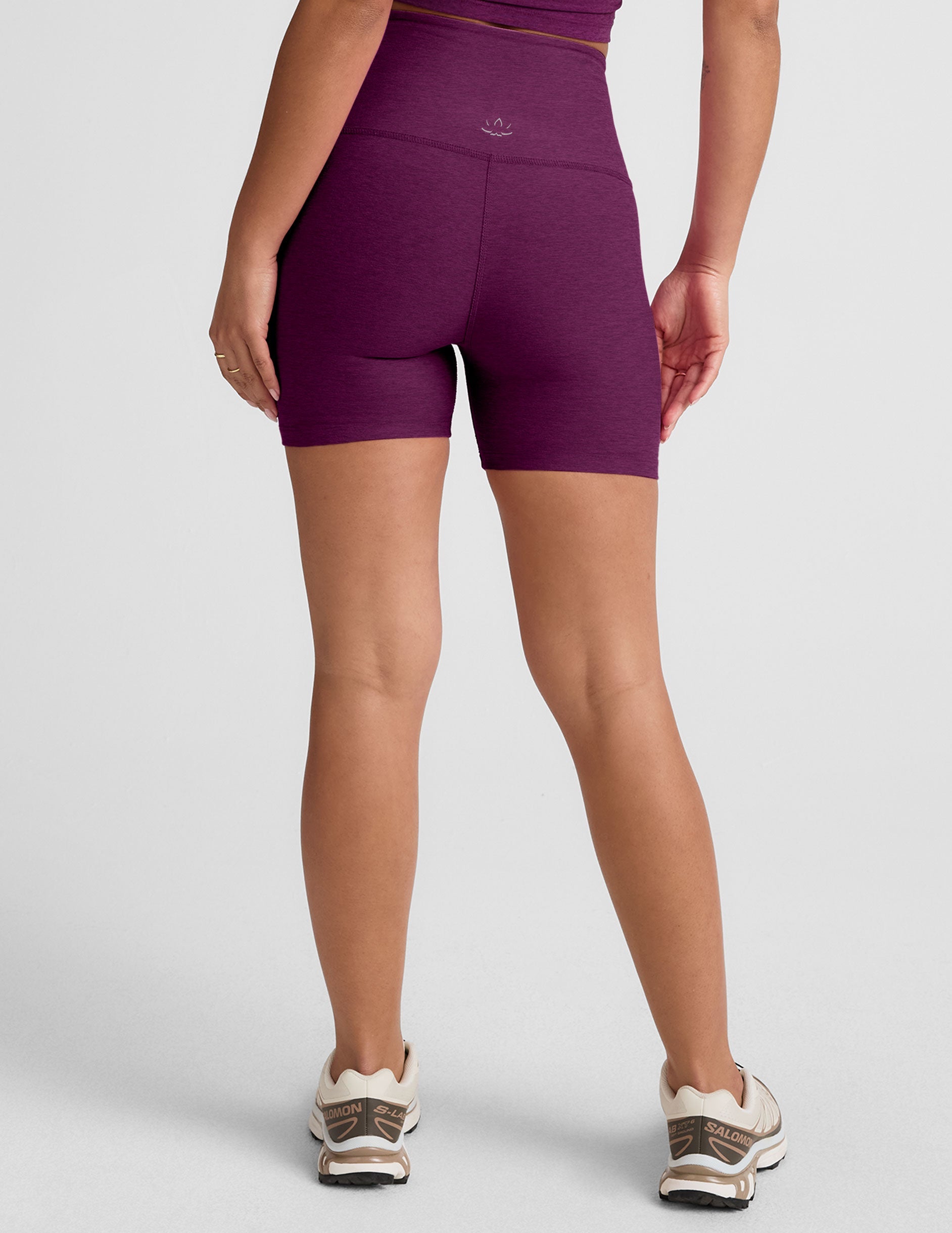 purple high-waisted, 5" inseam biker shorts. 