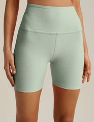 green high-waisted biker shorts with a 5" inseam. 